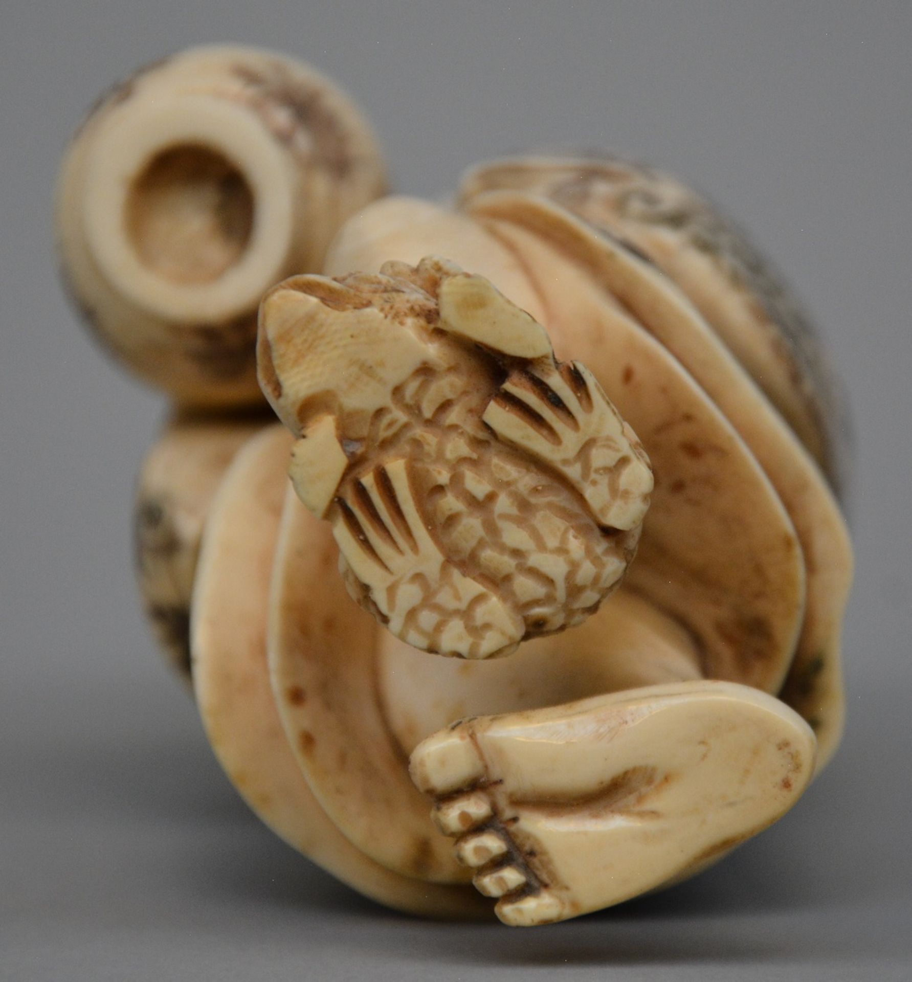 A Japanese ivory okimono of a man holding a lantern and stepping on a toad, scrimshaw decorated, - Image 7 of 7