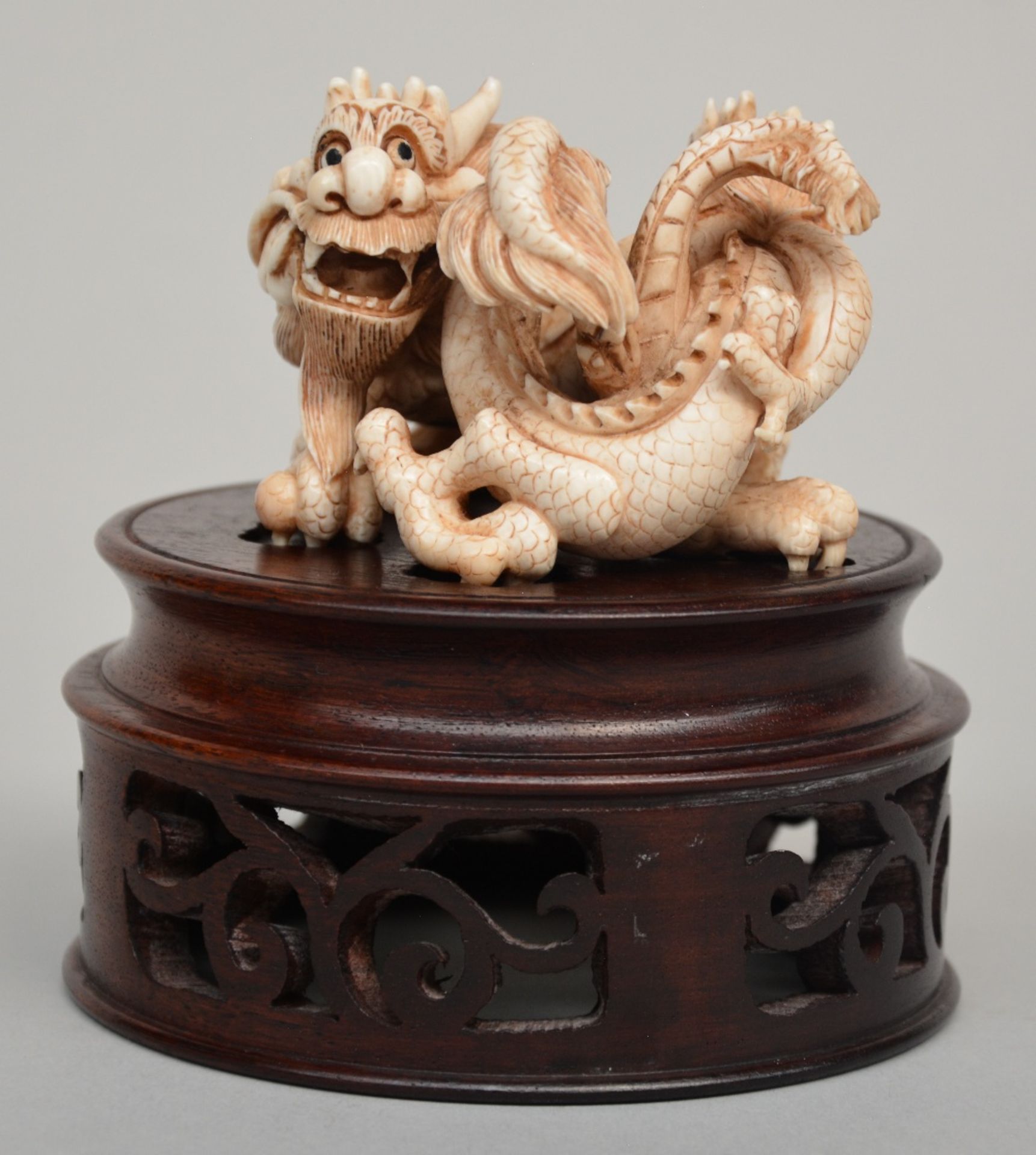 An Oriental ivory group of playing dragons on a wooden base, scrimshaw decorated, H 6 cm (without - Image 2 of 7