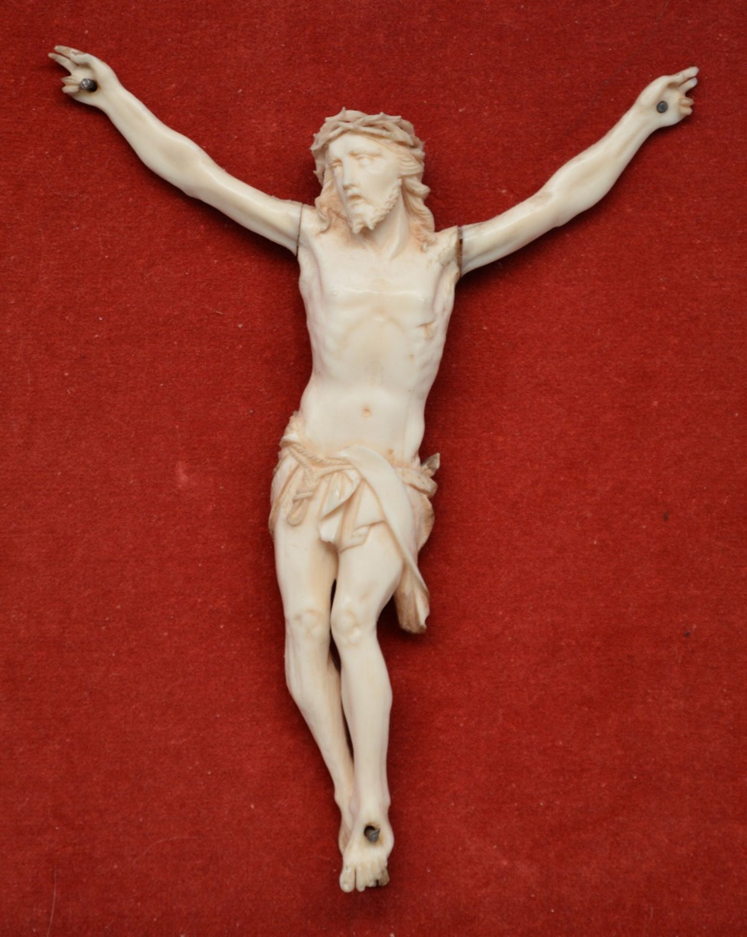 An ivory Christ, 19thC, in an ebonised frame, 14 x 18 cm (Christ), 36 x 40 cm (frame) (some damage) - Bild 2 aus 3