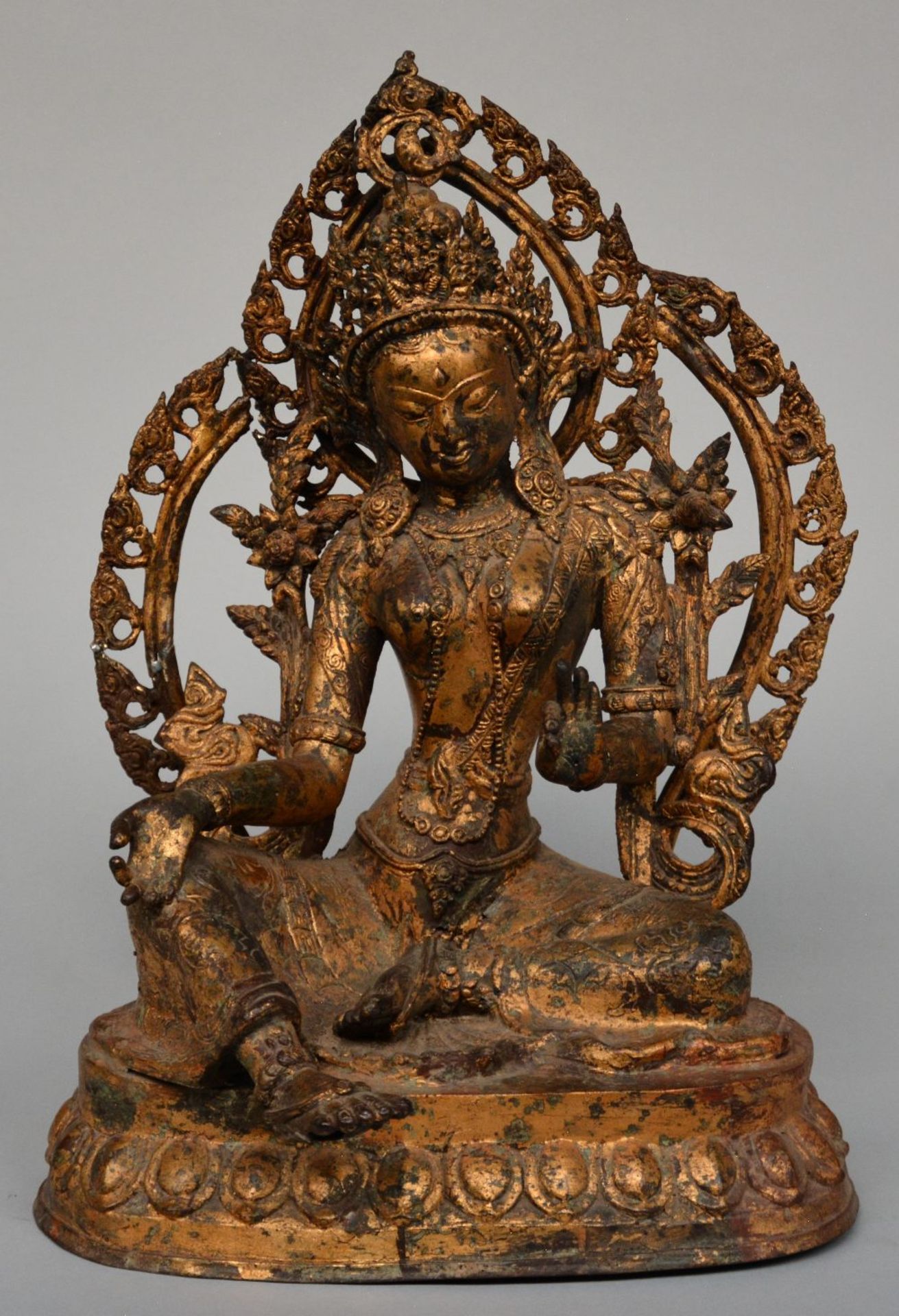 An Oriental gilt bronze Buddha, H 45 cm (restoration)