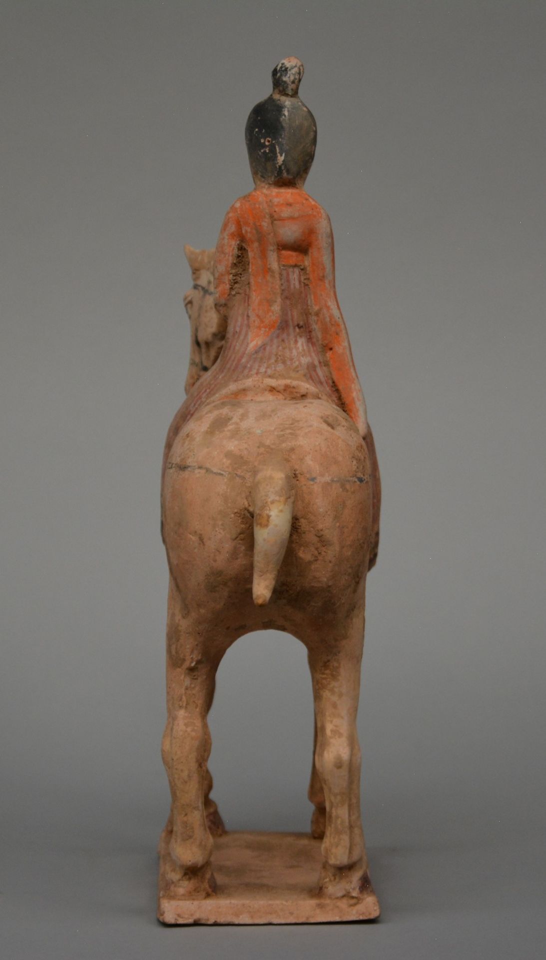 A Chinese earthenware figure of a horse rider, with traces of polychrome, Tang dynasty (618-906), - Bild 2 aus 7