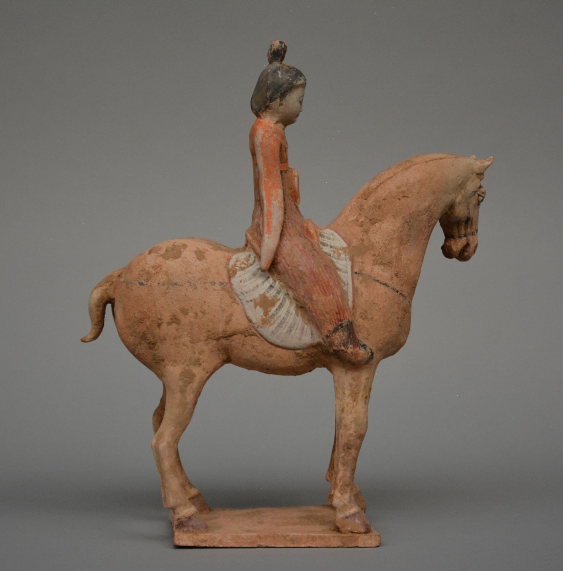 A Chinese earthenware figure of a horse rider, with traces of polychrome, Tang dynasty (618-906), - Bild 3 aus 7
