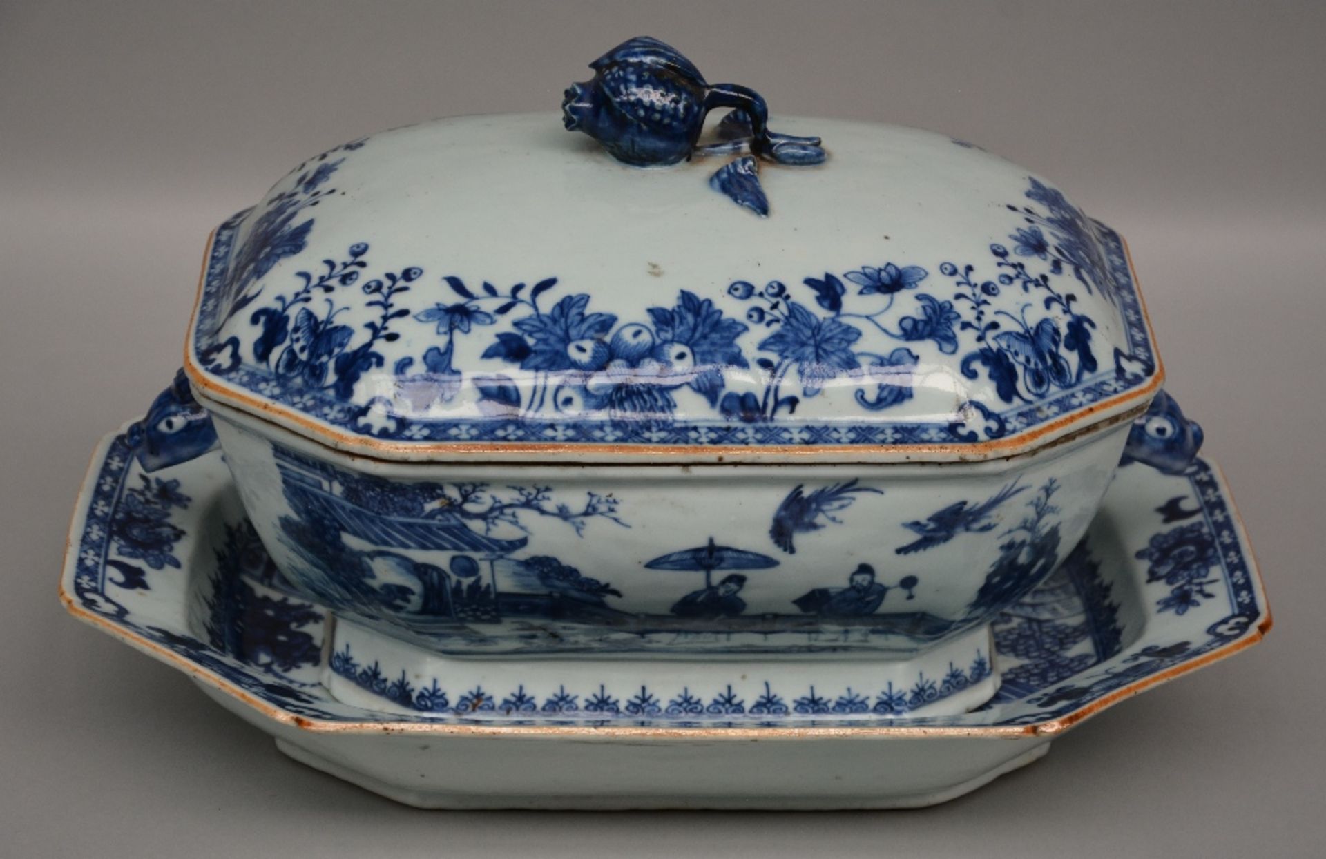 A Chinese blue and white octagonal tureen with underplate, decorated in the center with an