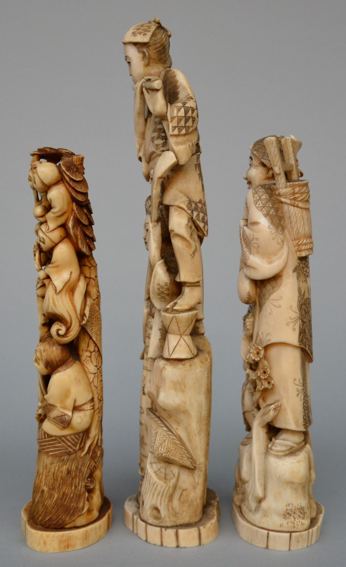 Three Japanese ivory okimono, scrimshaw decorated and tinted, Meiji period, H 29,5 cm - Weight 618 g - Image 2 of 5