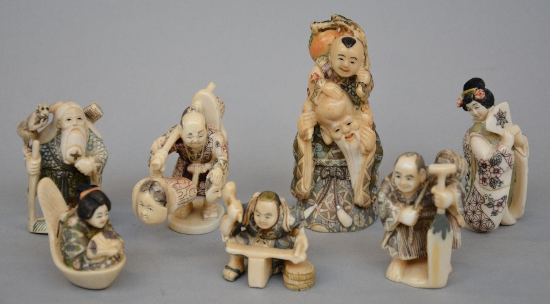 Seven netsuke/okimono, scrimshaw decorated, first half of 20thC, H 4 - 8,6 cm, Total weight 260 g