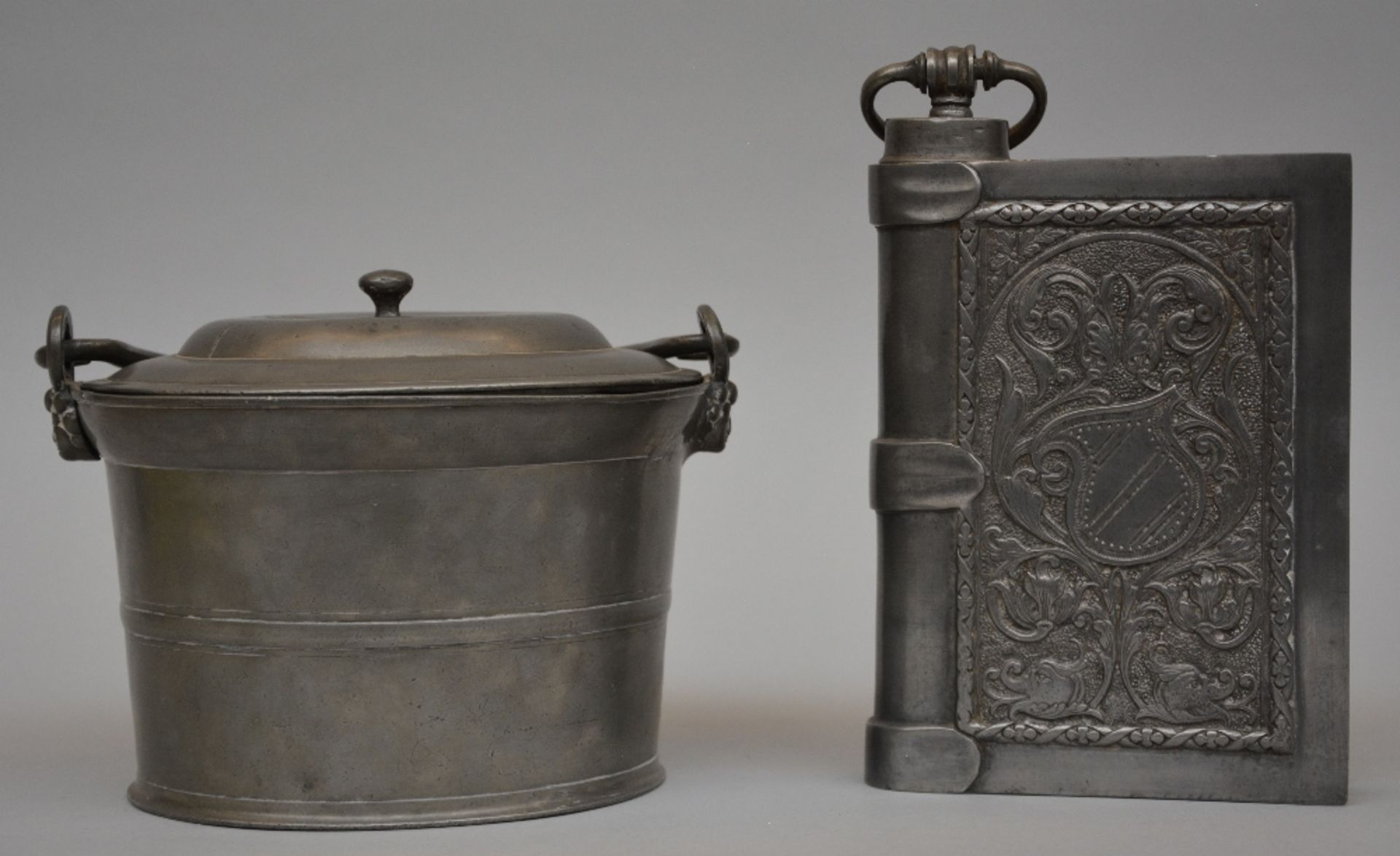 A 19thC French pewter feet warmer and a ditto food recipient, H 6 - W 26 - D 15cm / H 23 -