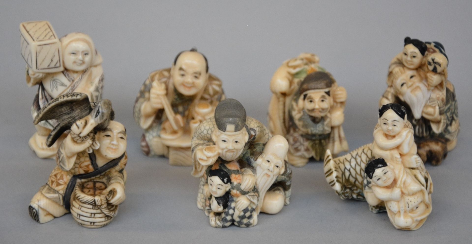 Seven ivory netsuke/okimino, scrimshaw decorated, first half of 20thC, H 5,2 - 4,1 cm, Total
