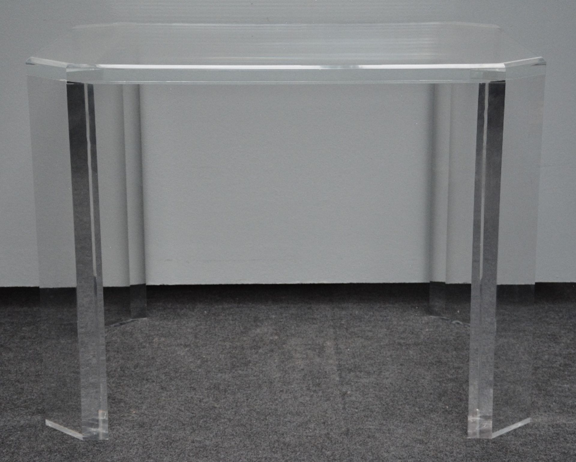 An octagonal designer table in acrylic glass, H 75,5 - W 100 - D 80,5 cm