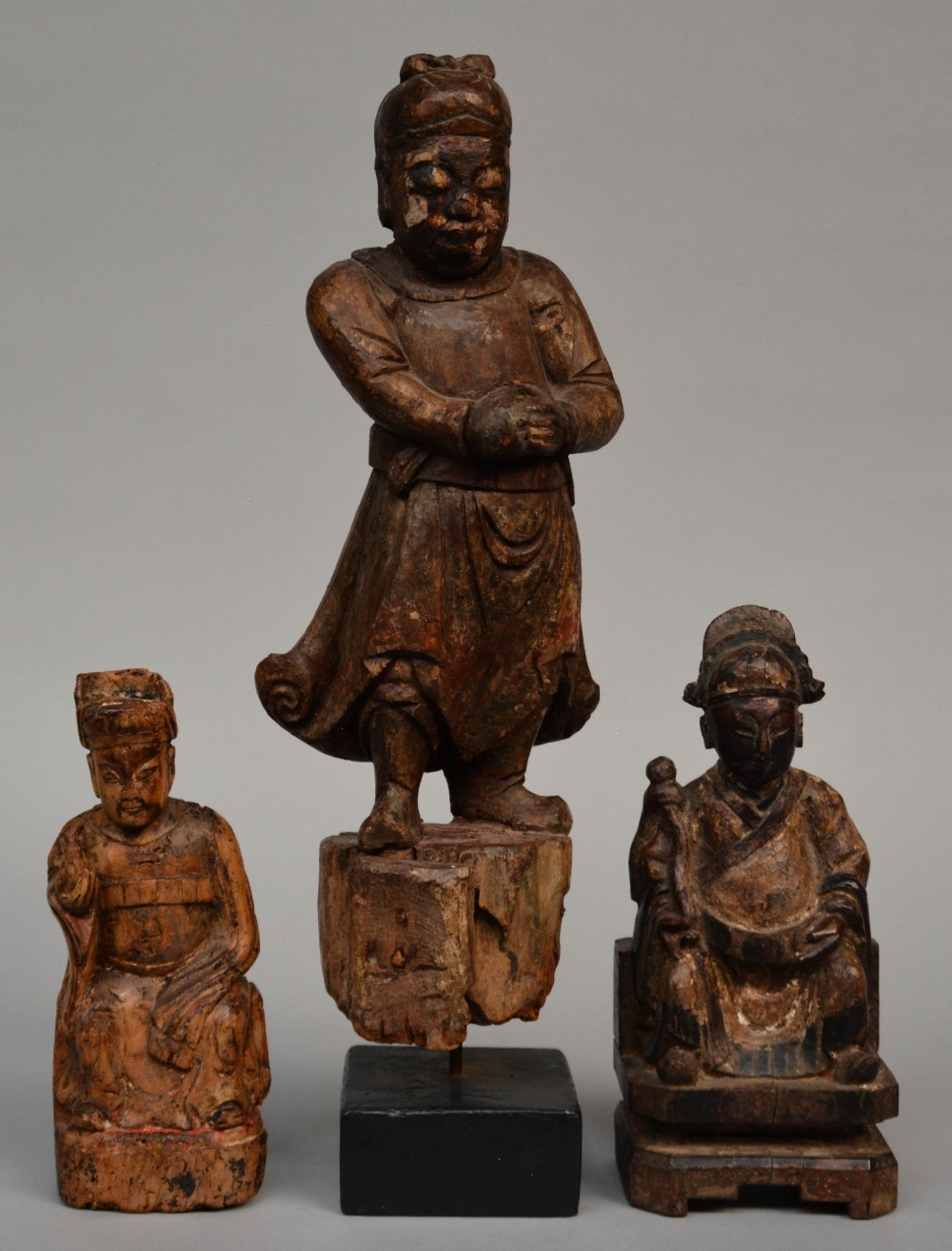 Three Oriental carved wooden sculptures, 19thC, H 24,5 - 27,5 - 52 cm