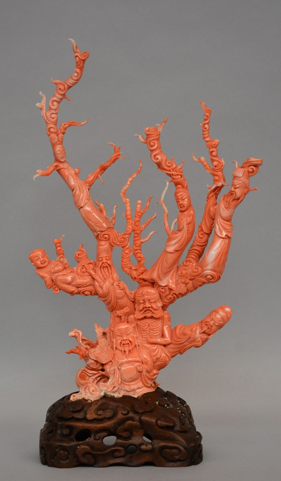 A Chinese red coral sculpture carved with five savants, two ladies and a child, H 39,5 cm, Total