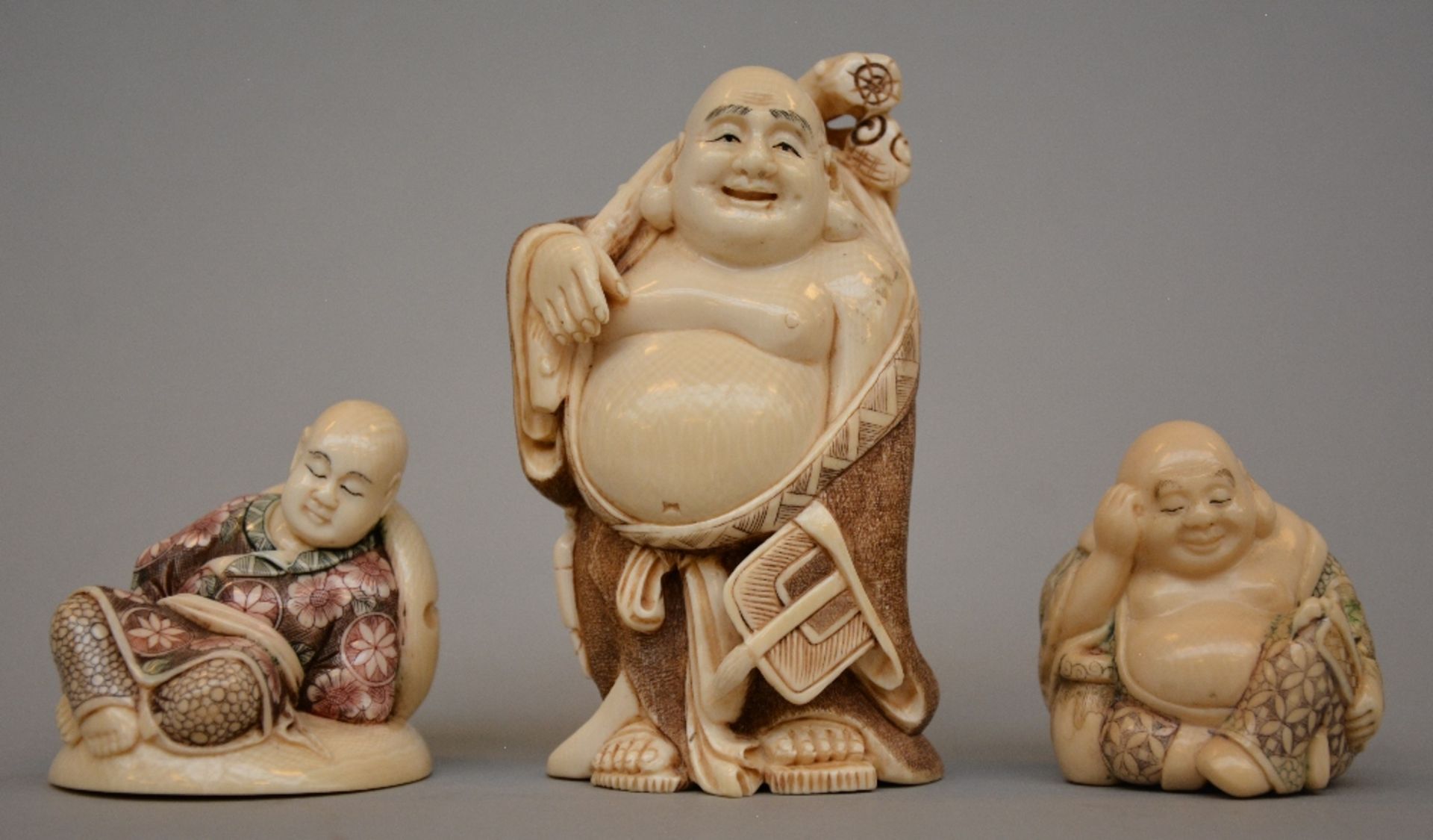 Three Japanese ivory okimono, scrimshaw decorated, first half of 20thC, H 10,3 / 5,5 / 5 cm, Total