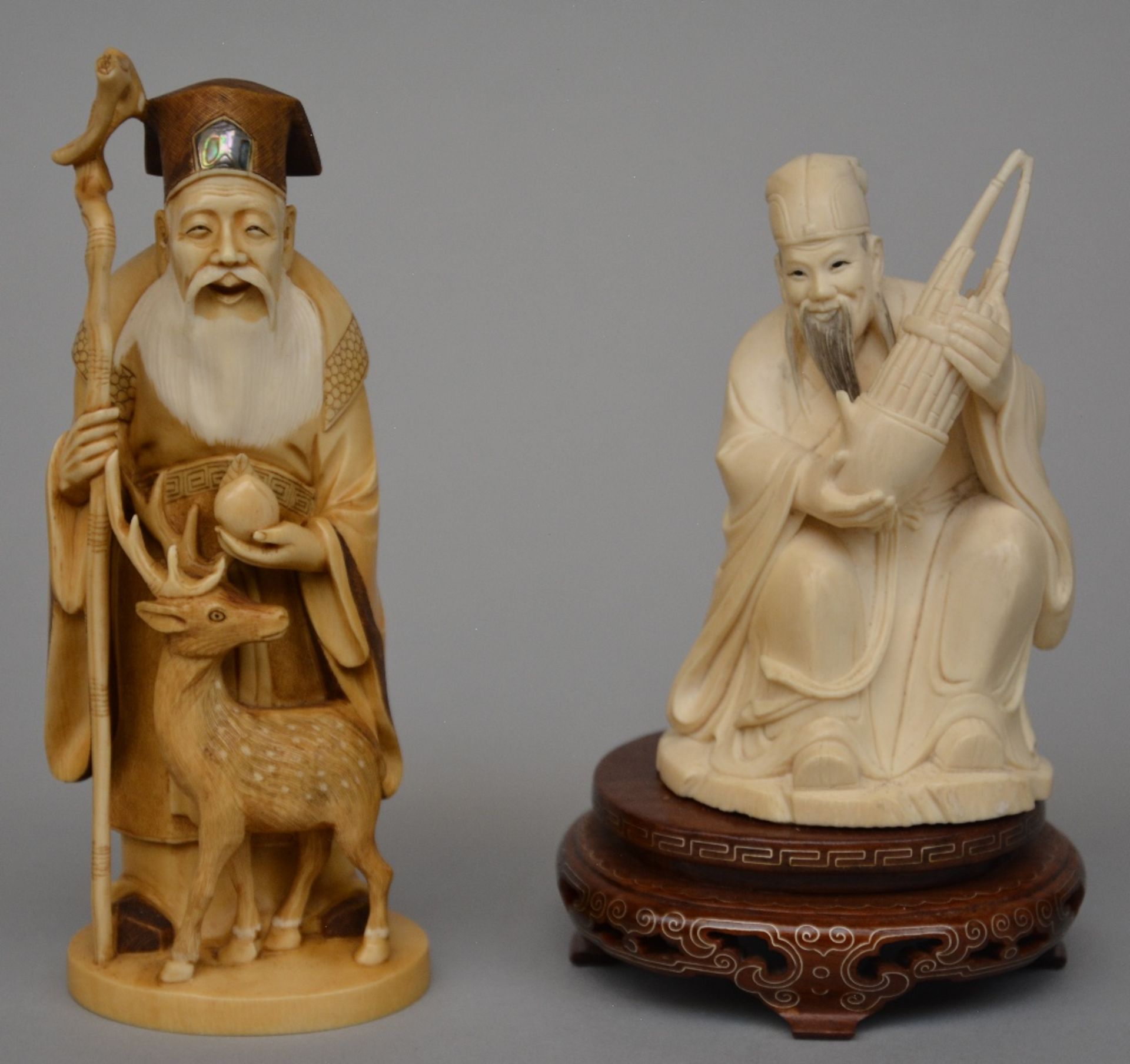 A Japanese ivory sculpture of the Old Man of the South Pole, scrimshaw decorated and tinted, late