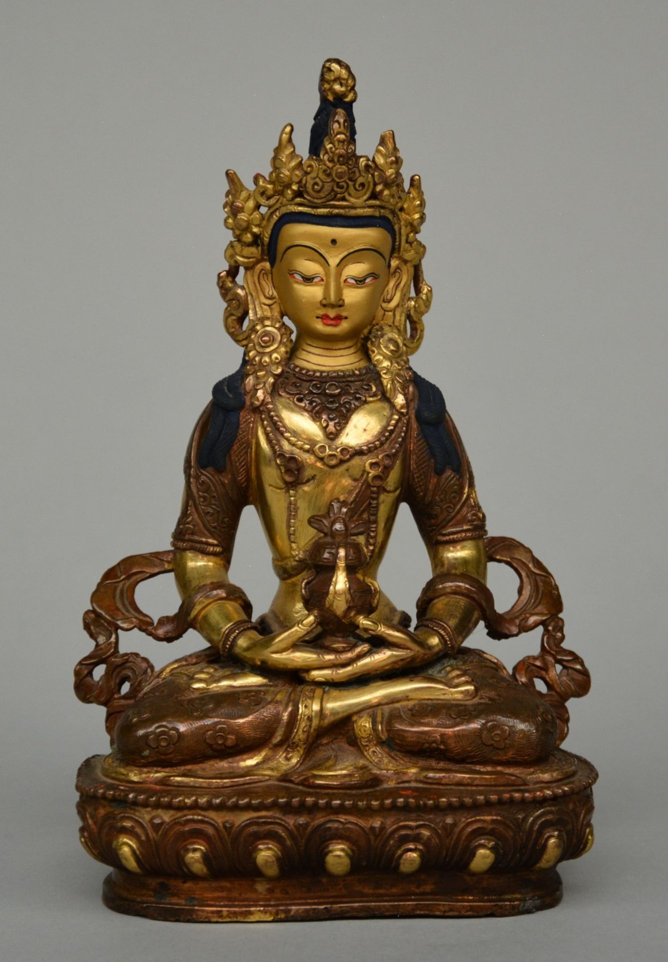 A Tibetan gilt bronze Buddha, H 20 cm