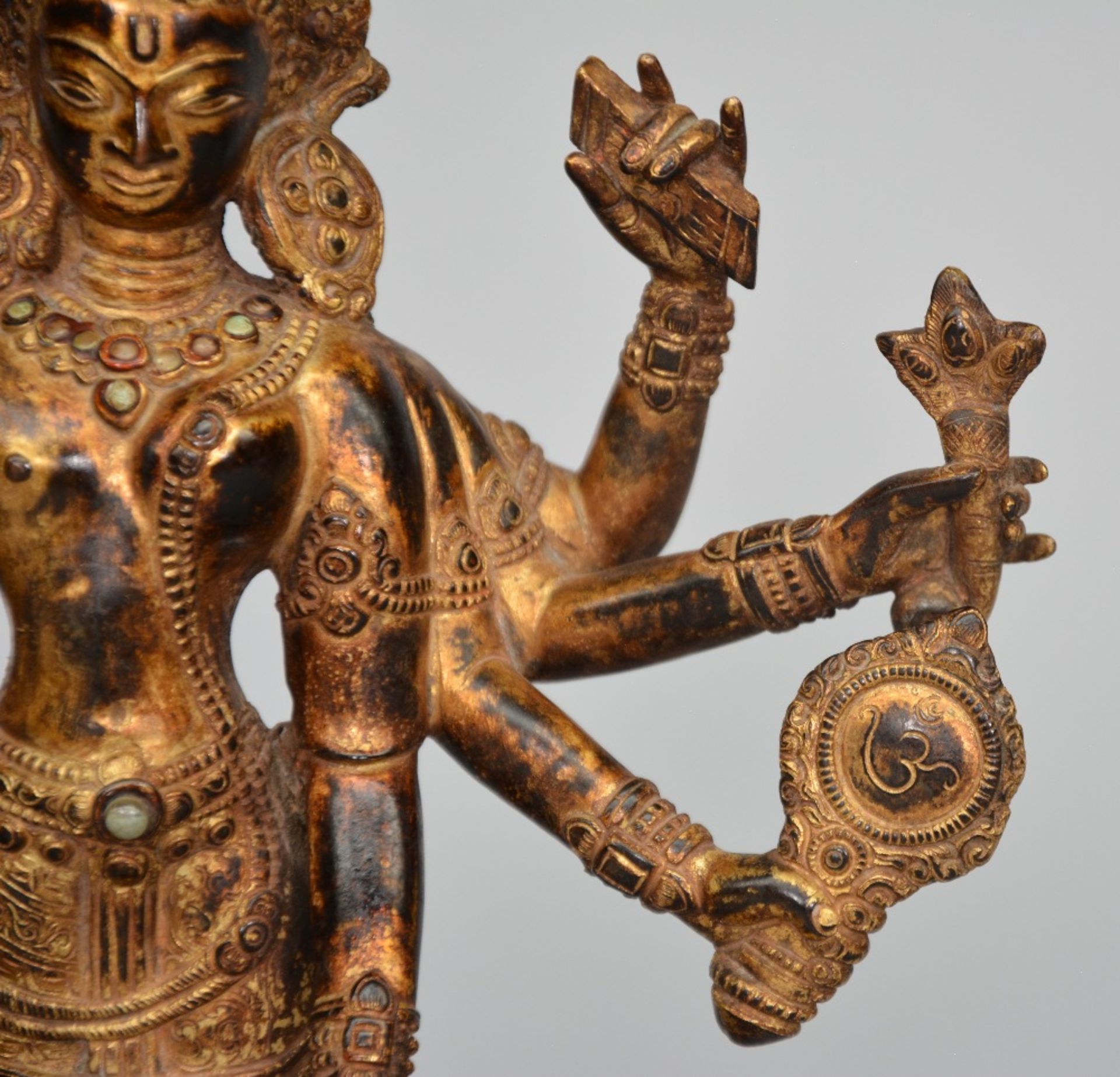 An Oriental gilt bronze polychrome figure, representing Shiva, decorated and inlaid with various - Image 3 of 9