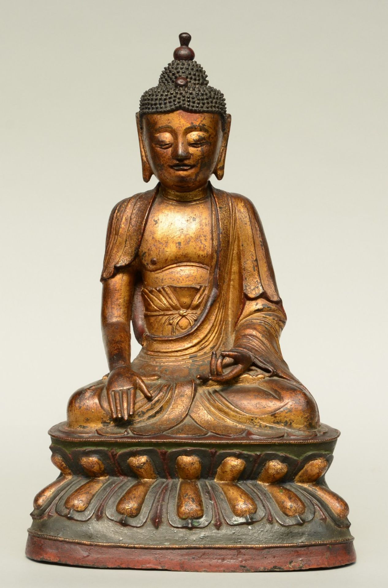 An Oriental gilt and polychrome decorated bronze Buddha, Ming, H 56,5 cm