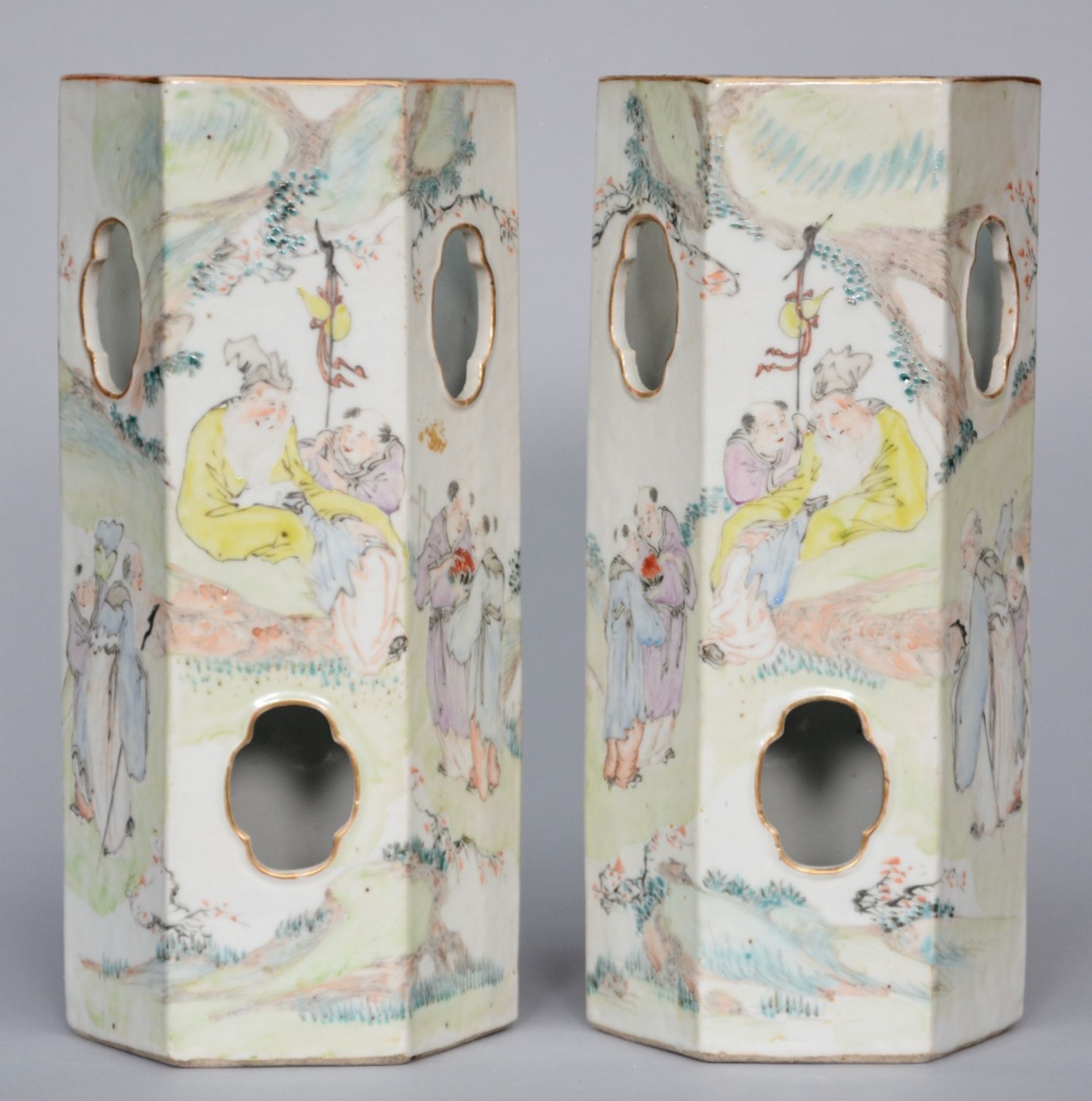 A pair of Chinese hat stands, polychrome decorated with a genre scene, signed by the artist, marked,