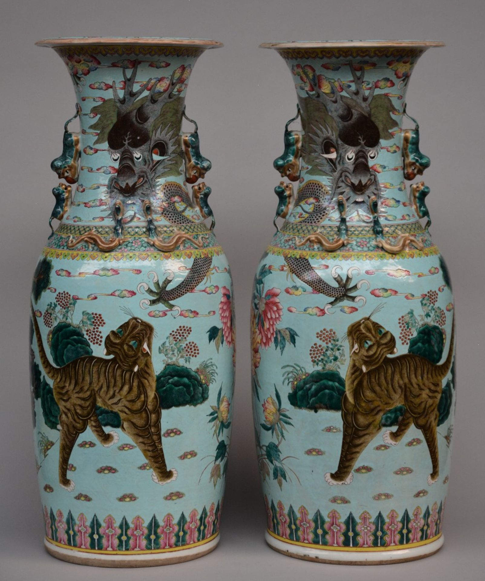 An exceptional pair Chinese turquoise vases, decorated with a dragon and a tiger in a landscape,