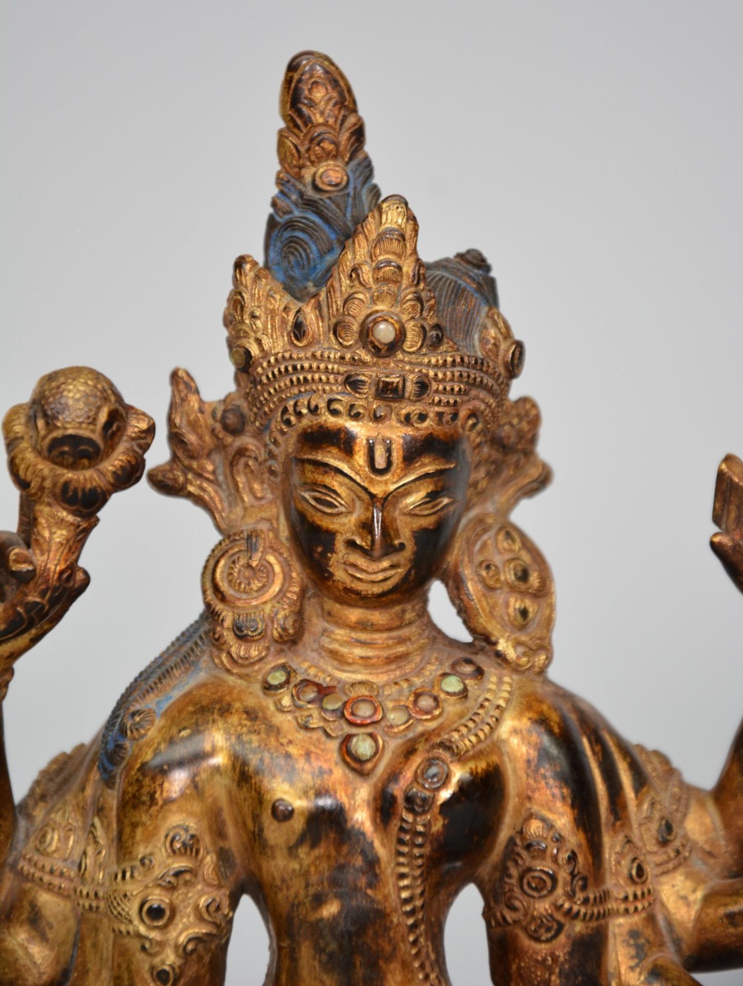 An Oriental gilt bronze polychrome figure, representing Shiva, decorated and inlaid with various - Image 2 of 9