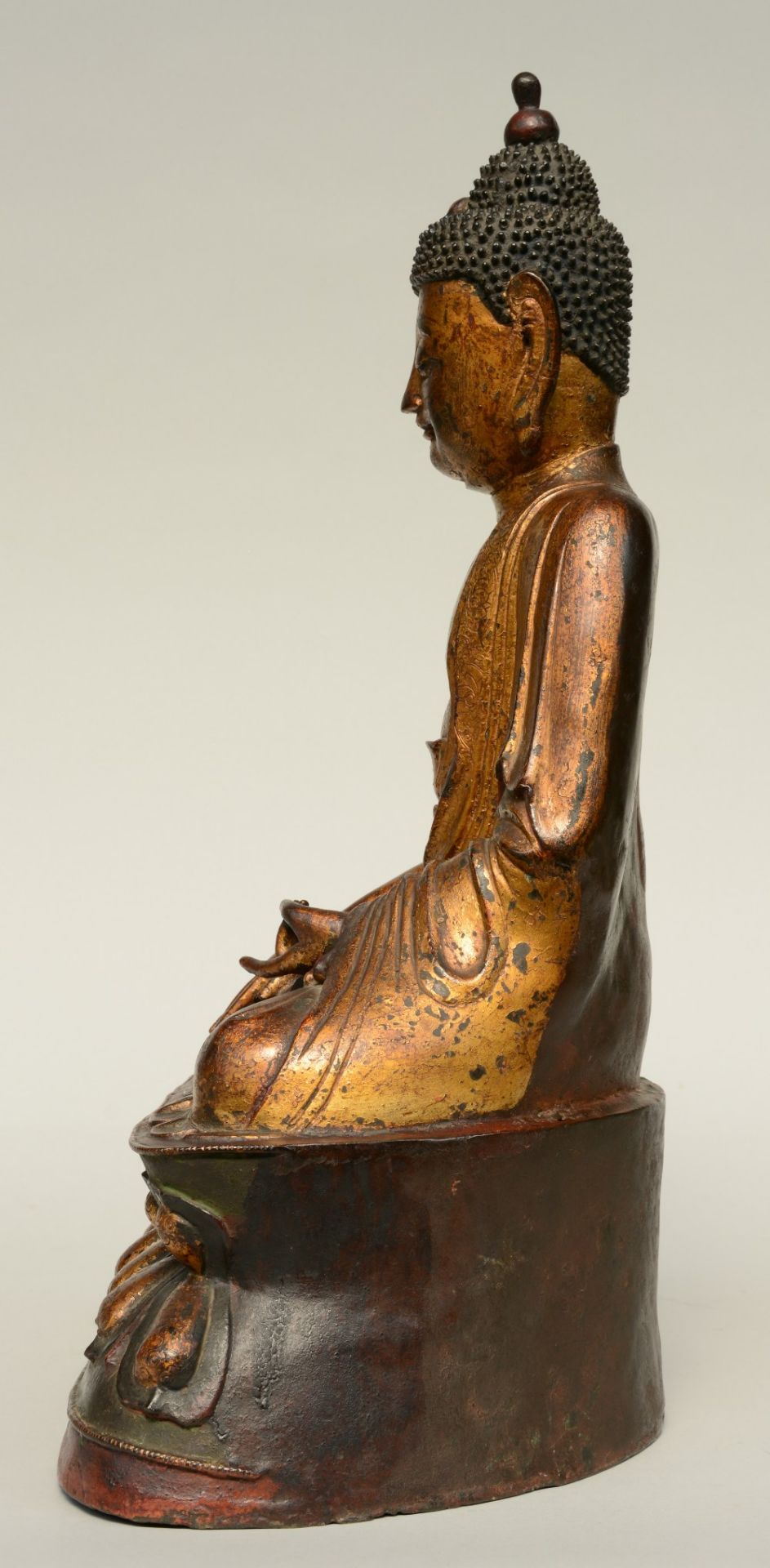 An Oriental gilt and polychrome decorated bronze Buddha, Ming, H 56,5 cm - Image 3 of 7