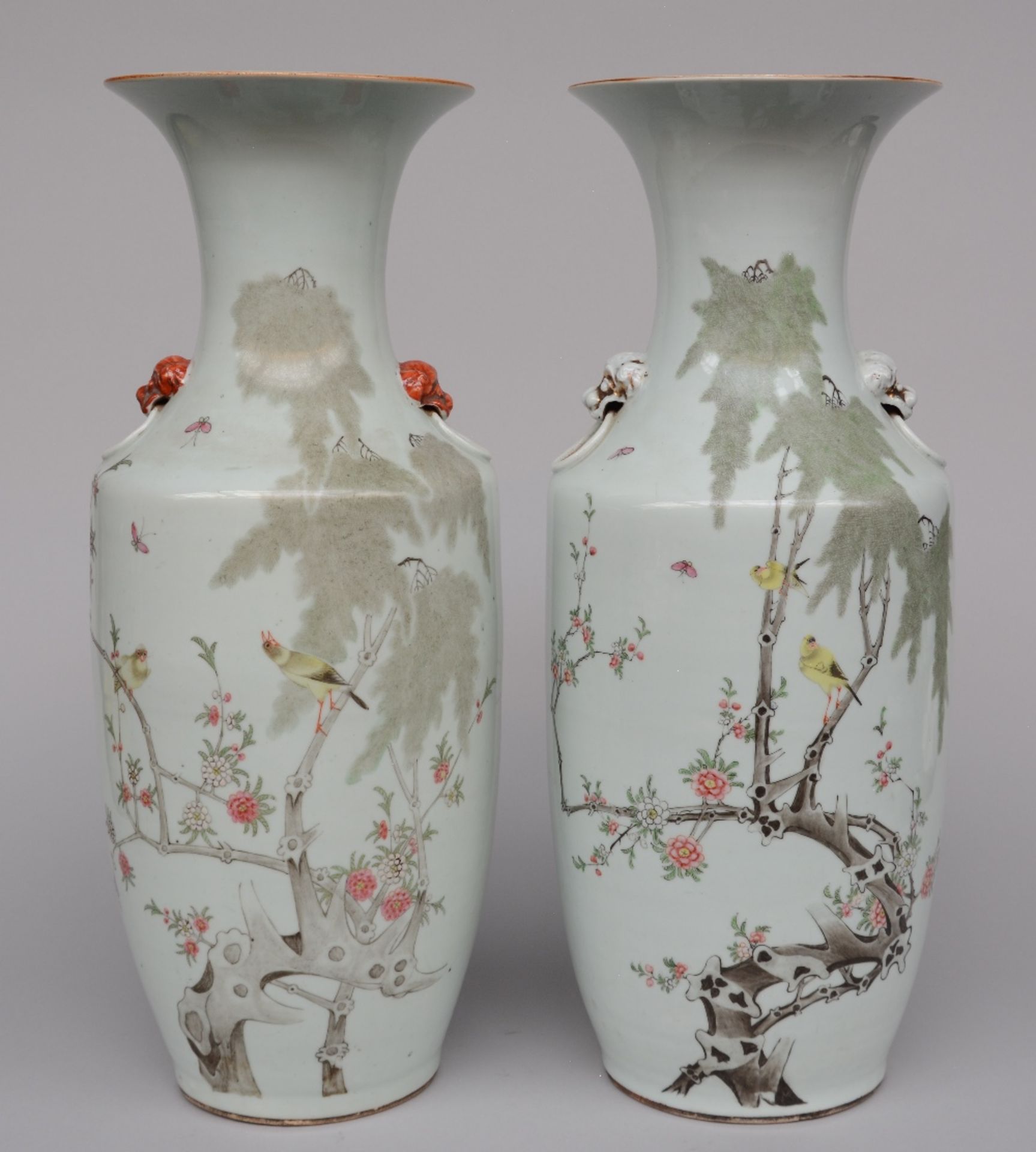 A pair of Chinese polychrome vases, decorated with birds on a flower branch, marked, H 57,5 cm (