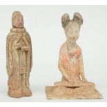 A Chinese earthenware funerary figure of a sitting female musician, Tang-Dynasty; added a Chinese