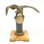 A late 19thC Neoclassical gilt bronze watch stand on a yellow Siena marble base; added an Omega