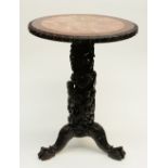 A Chinese carved wooden occasional table with marble top, H 75 - Diameter 59 cm