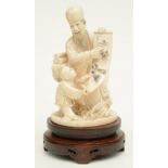 A late Qing dynasty ivory sculpture depicting a sage and his young pupil, refined scrimshaw