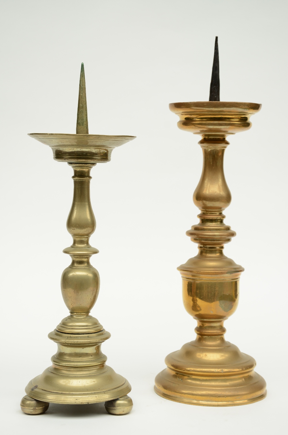 Two 17thC Low Countries pricket candlesticks, H 47,5 - 52,5 cm (some restoration)