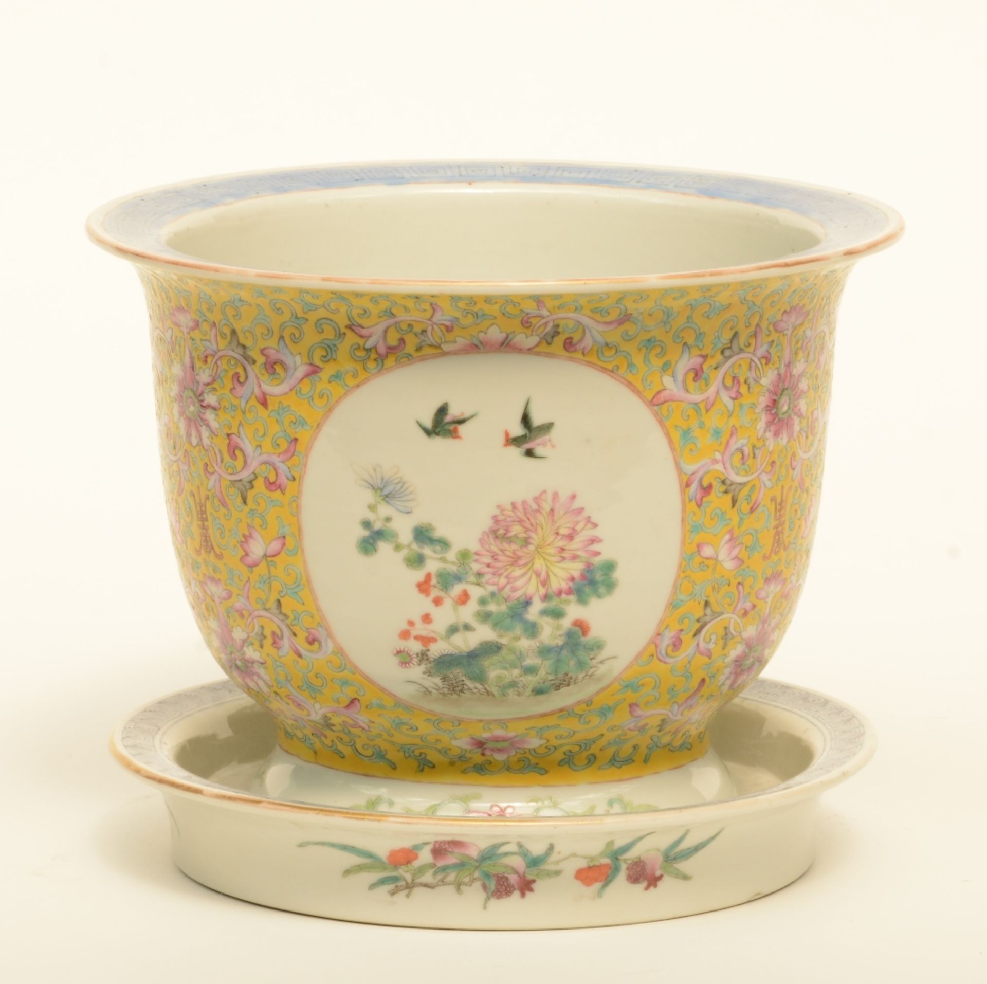 A Chinese famille rose and floral decorated cachepot in yellow background with matching plate, H
