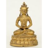 An Oriental gilt bronze Buddha, H 14,5 cm