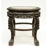 A Chinese carved wooden stool with a marble top, ca. 1900, H 58 - Diameter 65,5 cm (minor damage and