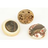 Three late Edo and early Meiji period Japanese ivory Manju-netsuke, one of them of the Ry?sa type