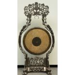 A Chinese bronze gong in a carved hardwood frame, H 128 - W 66 cm