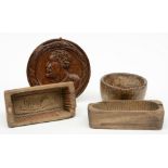 Three 18thC Low Countries wooden butter molds; added a 17thC oak tondo, H 9 - W 20,5 - 21,5 -