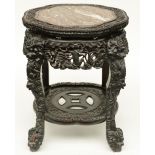 A Chinese carved hardwood stool with marble top, H 53,5 - Diameter 52,5 cm (minor damage)