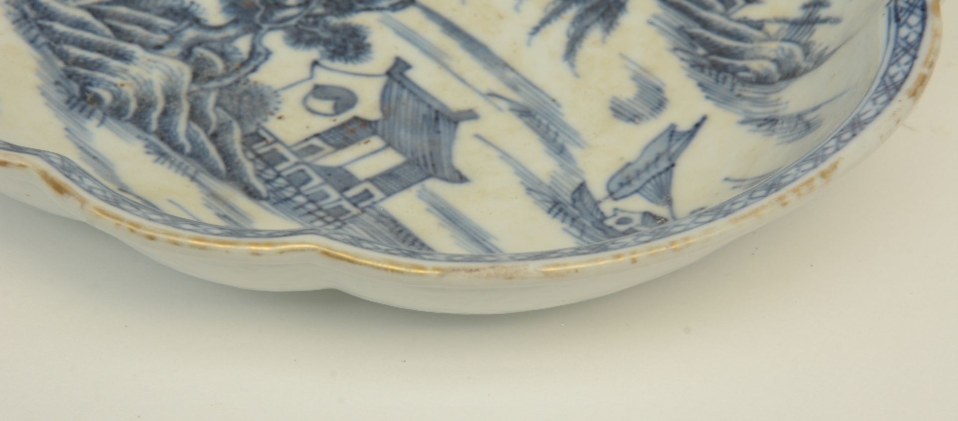 A Chinese oval dish with a profiled rim, blue and white decorated with a landscape, 18thC, - Image 4 of 4