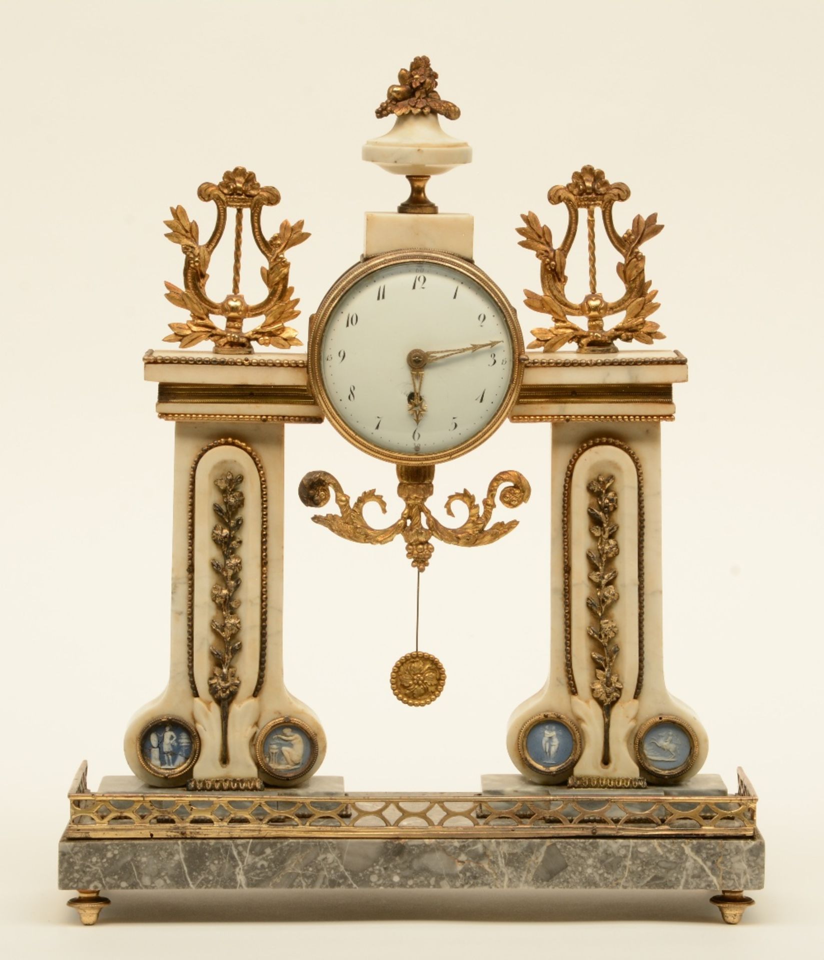 A French late 19thC mantle clock, Carrara and gris des ardennes marble with bronze mounts, mechanism