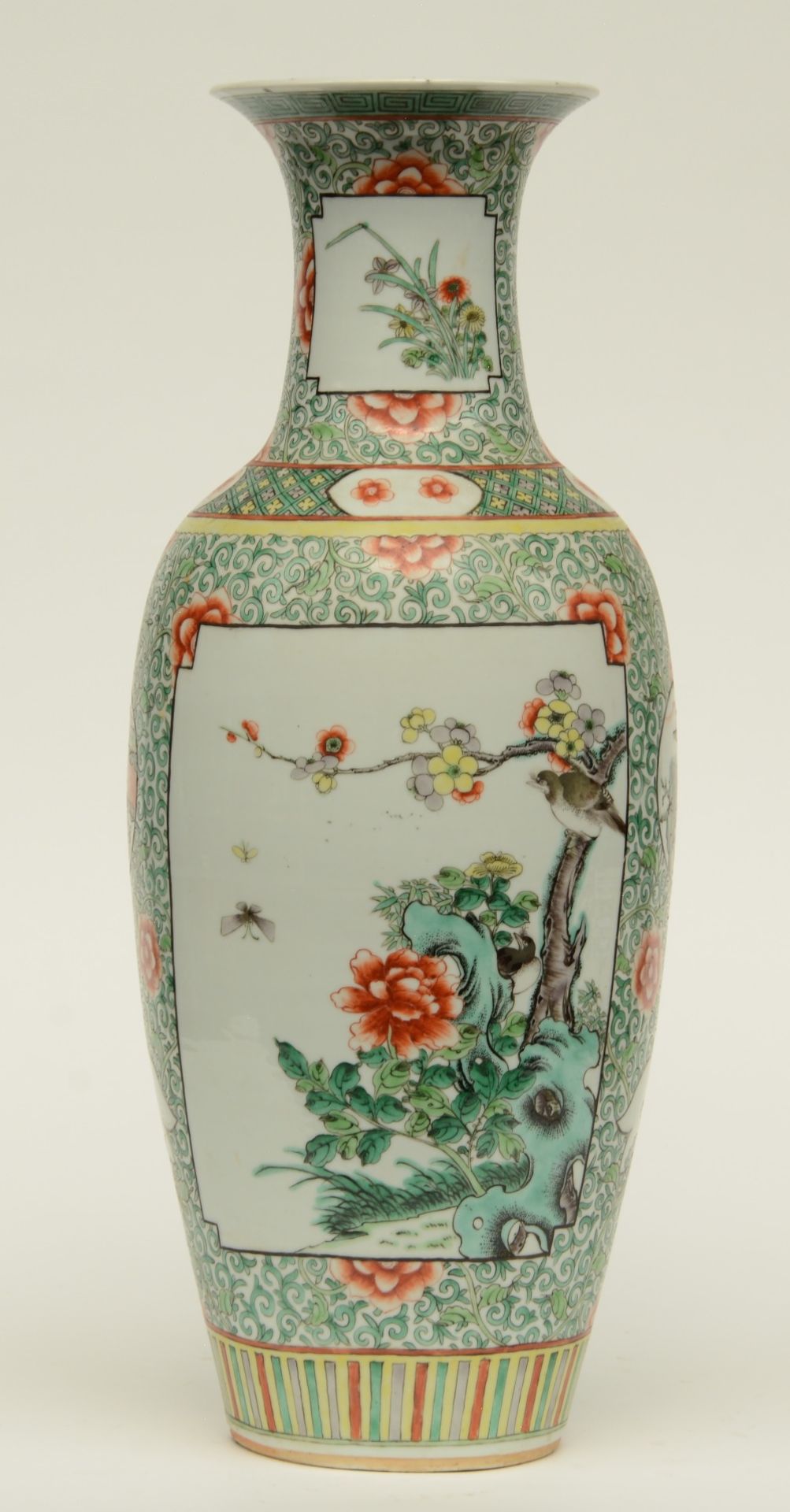 A Chinese polychrome vase decorated with flower branches, landscapes and floral motifs, H 60 cm