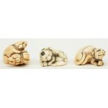 Three late Edo period Japanese ivory katabori-netsuke, in the form of playing cat and playing