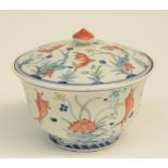 A Chinese doucai bowl with cover, decorated with fishes, with a Jiajing-mark, H 11,5 cm - Diameter