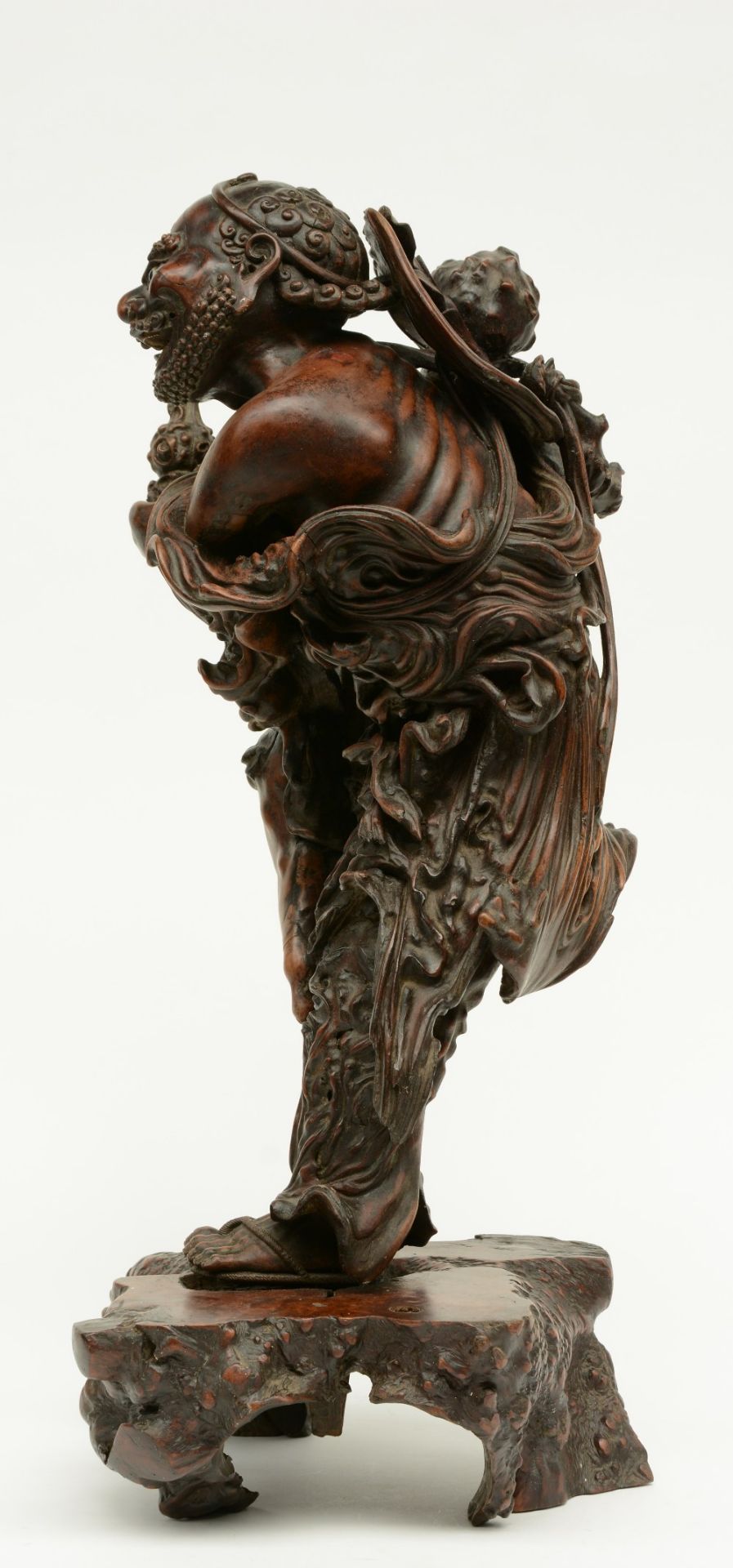 A Chinese walnut carved sculpture depicting a mythical figure, 19thC, H 64 cm (left indexfinger - Image 2 of 4