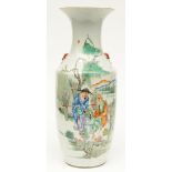 A Chinese polychrome vase decorated with figures in a landscape, H 58,5 cm