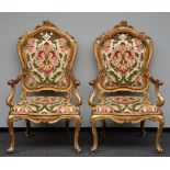 A pair of richly carved gilt wooden Rococo armchairs, probably Italy, 18thC, H 122,5 - W 73 cm (