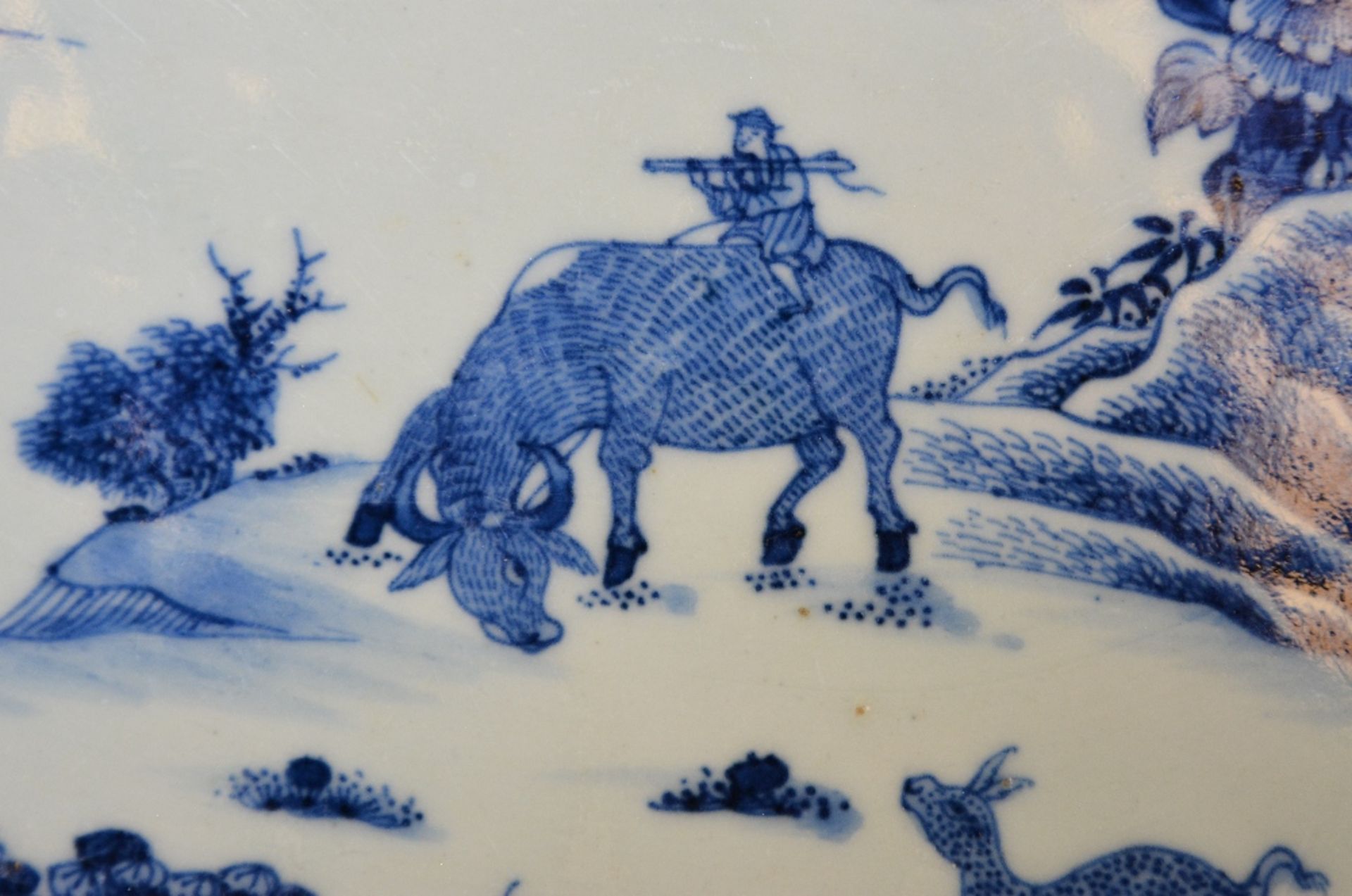 A Chinese oval dish with profiled rim, blue and white decorated with a landscape and floral - Image 3 of 5