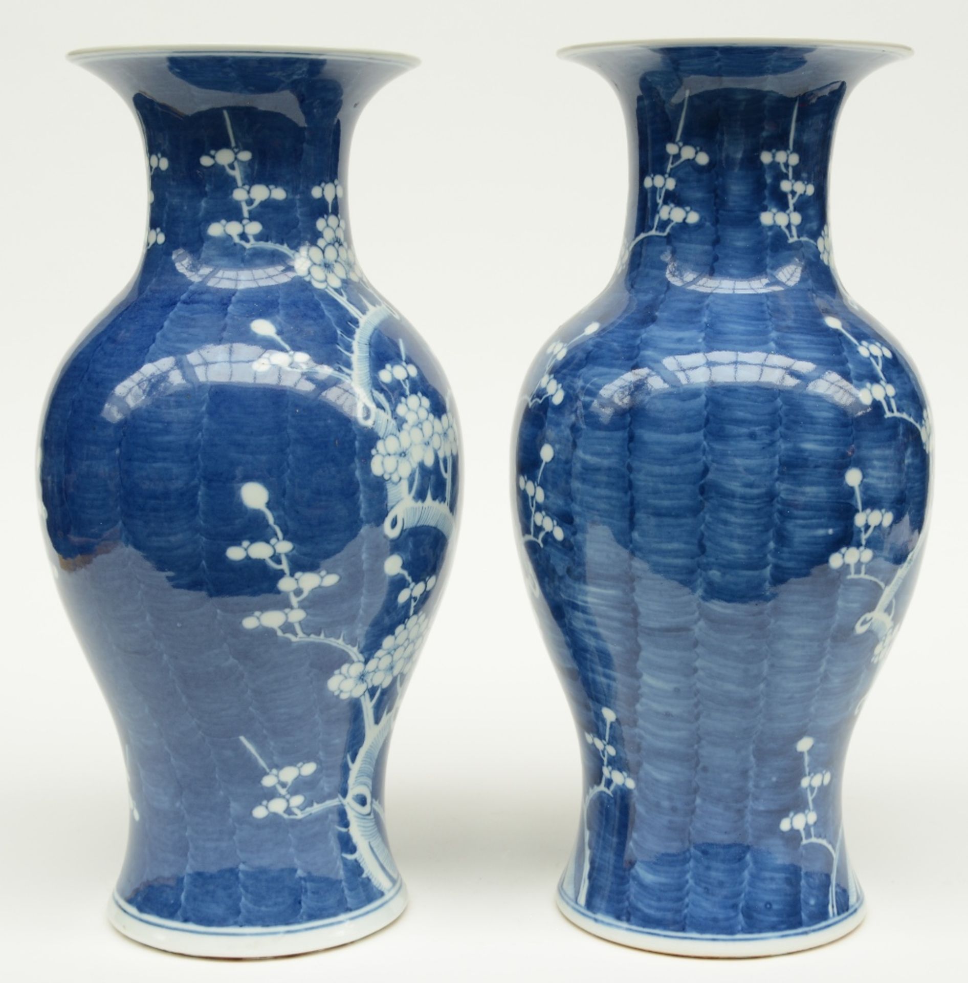 A pair of Chinese blue and white decorated vases painted with prunus blossoms, H 42,5 cm - Image 2 of 6