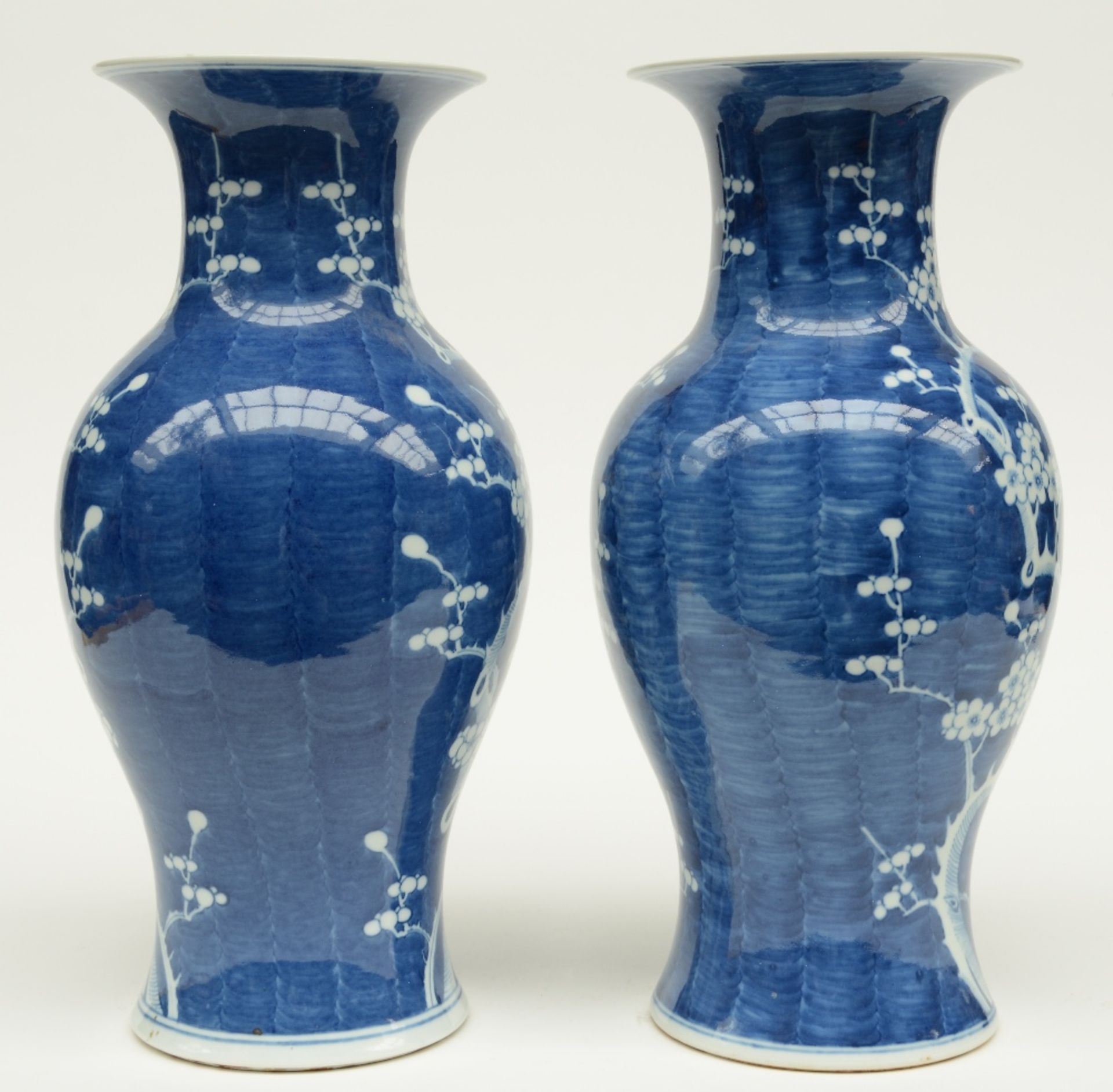 A pair of Chinese blue and white decorated vases painted with prunus blossoms, H 42,5 cm - Image 4 of 6