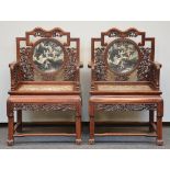 An exceptional pair of Chinese hardwood armchairs with relief decorations of dragons and marble