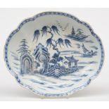 A Chinese oval dish with a profiled rim, blue and white decorated with a landscape, 18thC,