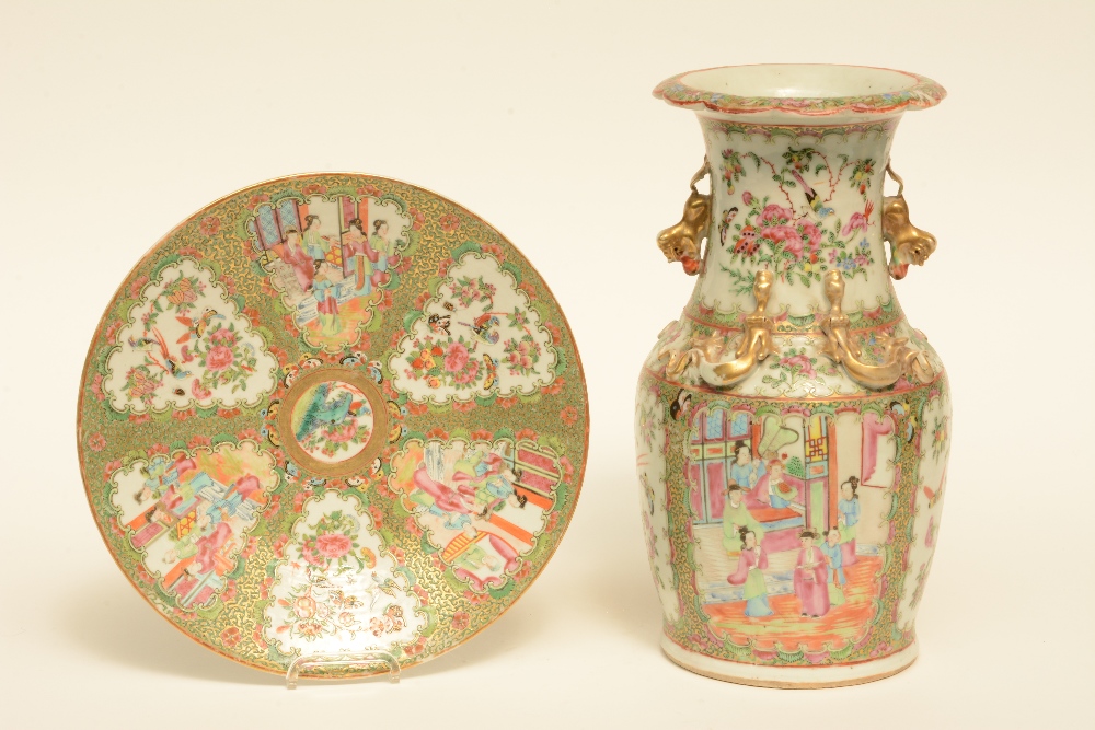 A Chinese Canton vase and plate, famille rose decorated with court scenes and birds on flower
